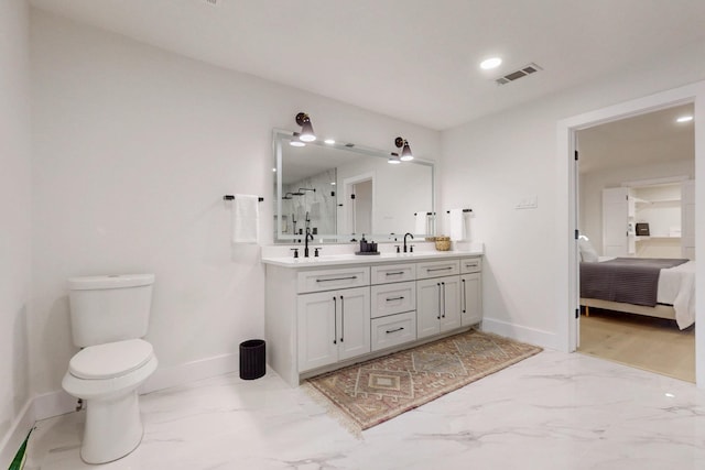 bathroom featuring marble finish floor, a shower stall, and baseboards