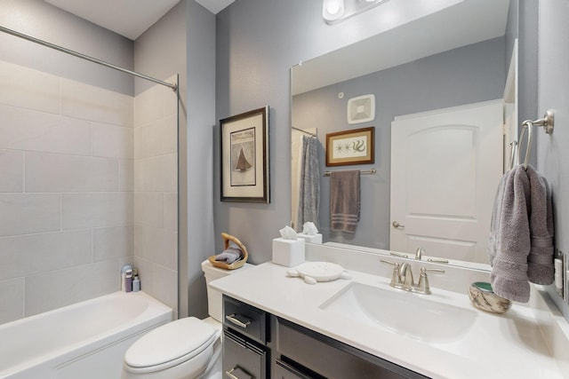 bathroom with toilet, vanity, and shower / tub combo