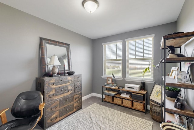 home office featuring baseboards and carpet floors