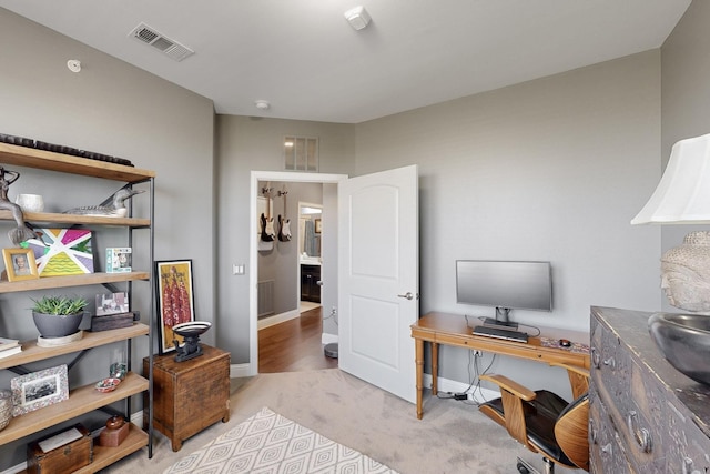 office with visible vents and baseboards