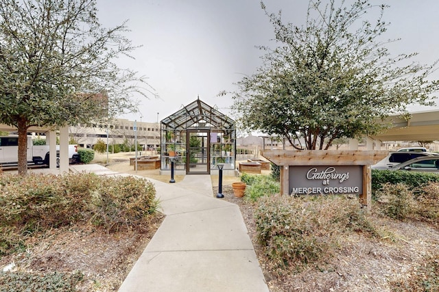 surrounding community featuring a greenhouse and an outbuilding