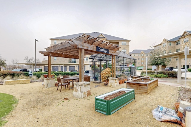 surrounding community with a pergola and a vegetable garden