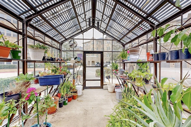 unfurnished sunroom featuring vaulted ceiling