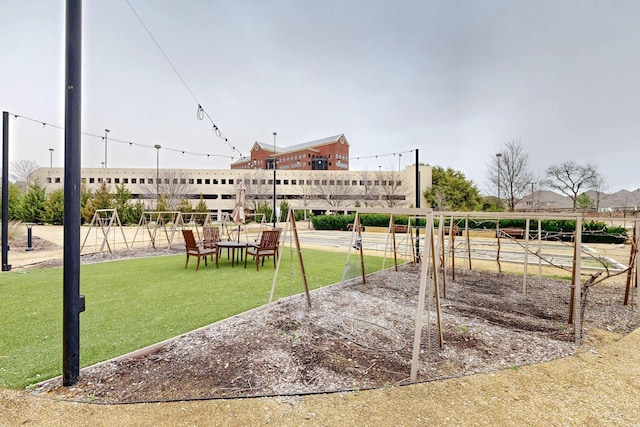 view of community featuring a lawn and playground community