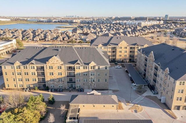 bird's eye view featuring a residential view and a water view