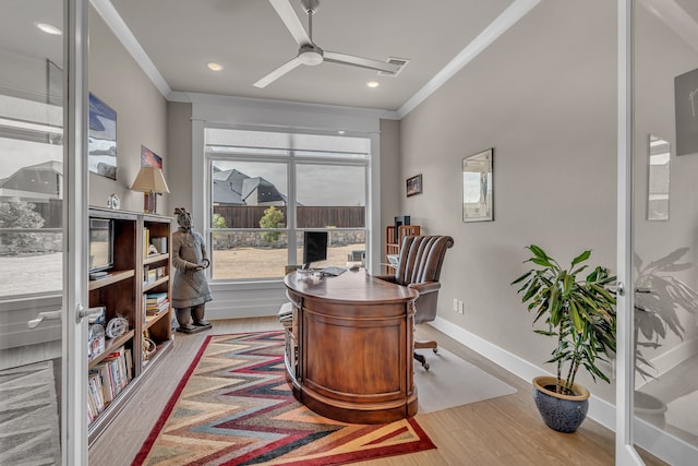 office featuring ornamental molding, wood finished floors, a ceiling fan, and baseboards