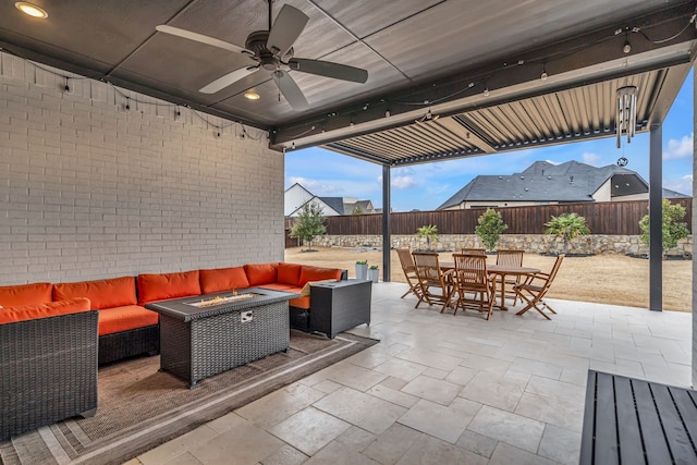 view of patio / terrace with ceiling fan, a fenced backyard, outdoor dining area, and an outdoor living space with a fire pit