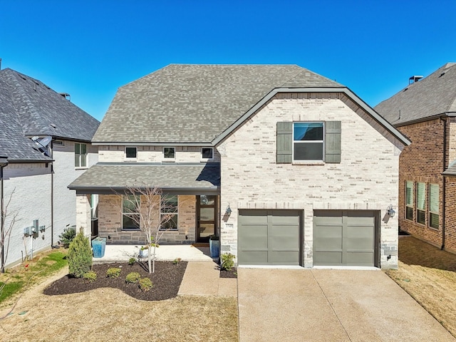 view of front of home featuring an attached garage, covered porch, brick siding, driveway, and roof with shingles