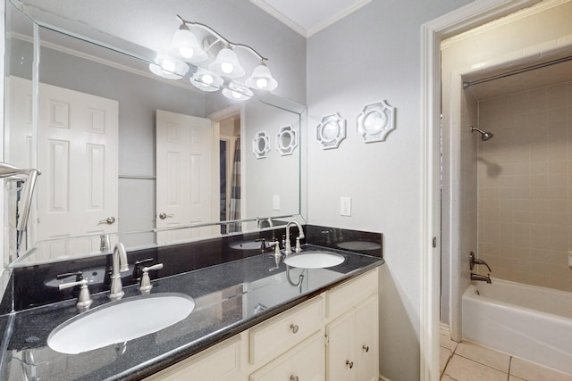 bathroom featuring tile patterned floors, double vanity, shower / tub combination, and a sink