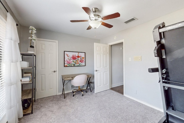 office area with a ceiling fan, baseboards, visible vents, and carpet floors