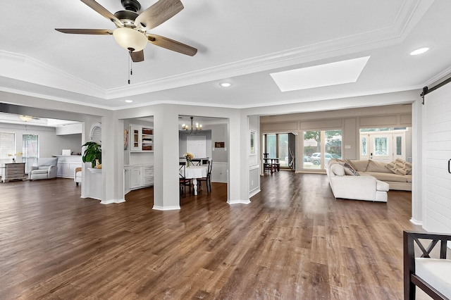 1721 Plummer Dr, Rockwall, TX 75087 - living room with healthy amount of natural light, crown molding, wood finished floors, recessed lighting, and a skylight