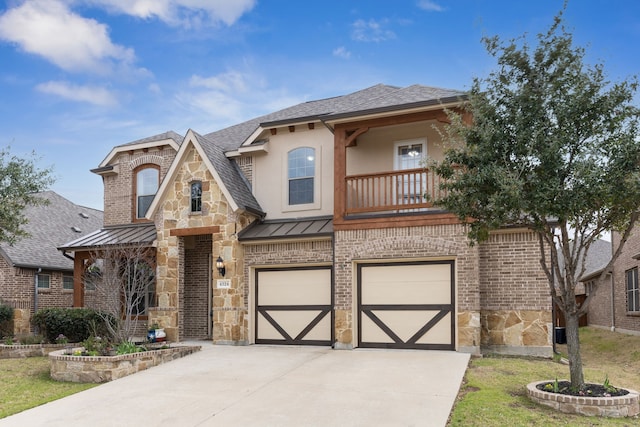 view of front of house with an attached garage, a standing seam roof, driveway, and stone siding