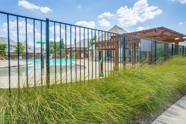 view of pool with fence