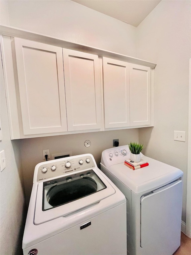 laundry area with cabinet space and washer and dryer