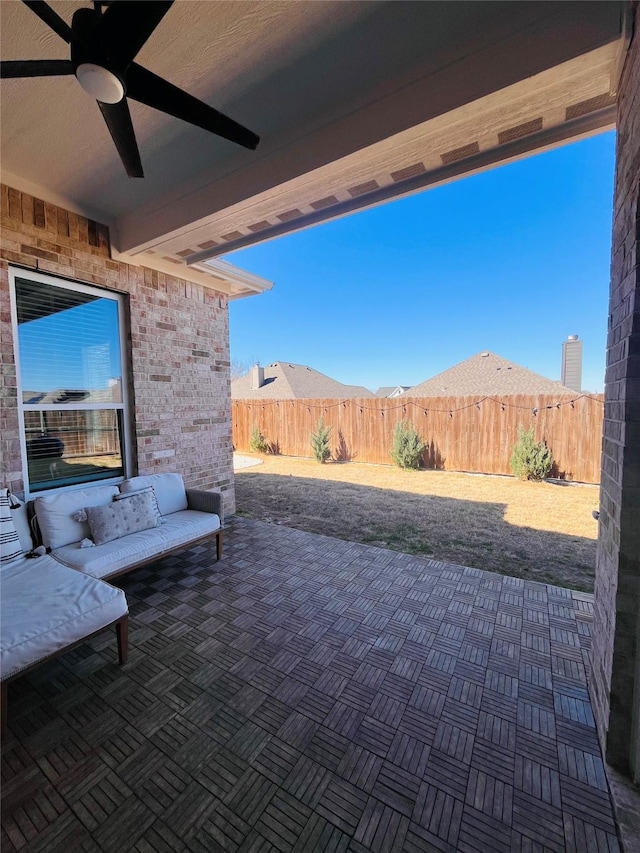 view of patio / terrace with a fenced backyard and ceiling fan