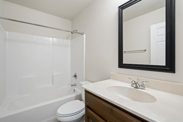 bathroom with washtub / shower combination, vanity, and toilet