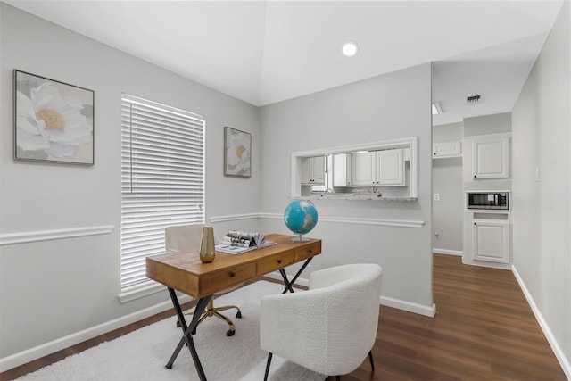 office area with dark wood-style floors, recessed lighting, visible vents, and baseboards