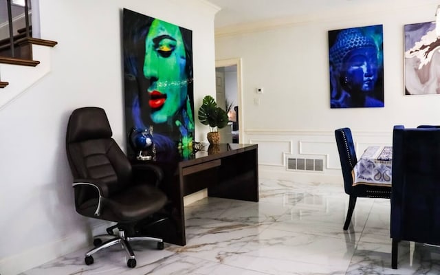 office featuring marble finish floor, visible vents, a decorative wall, and crown molding