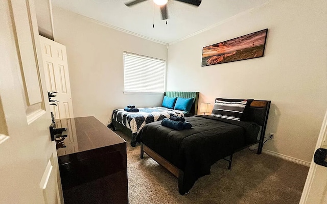 bedroom featuring ceiling fan, ornamental molding, carpet, and baseboards