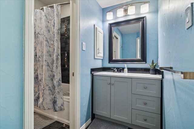 2616 NW Lambda Ln, Flower Mound, TX 75028 - full bathroom featuring vanity and shower / tub combo with curtain