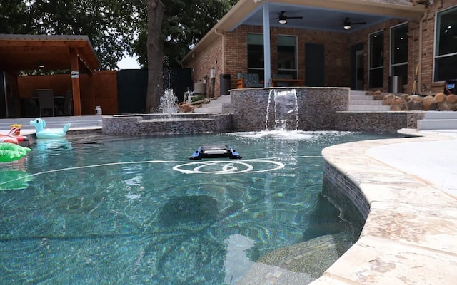 view of swimming pool with a ceiling fan