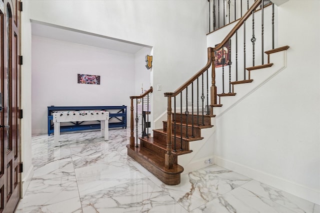 2616 NW Lambda Ln, Flower Mound, TX 75028 - entryway featuring marble finish flooring, baseboards, and stairs
