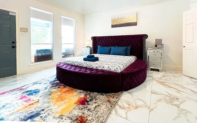 bedroom featuring marble finish floor and baseboards