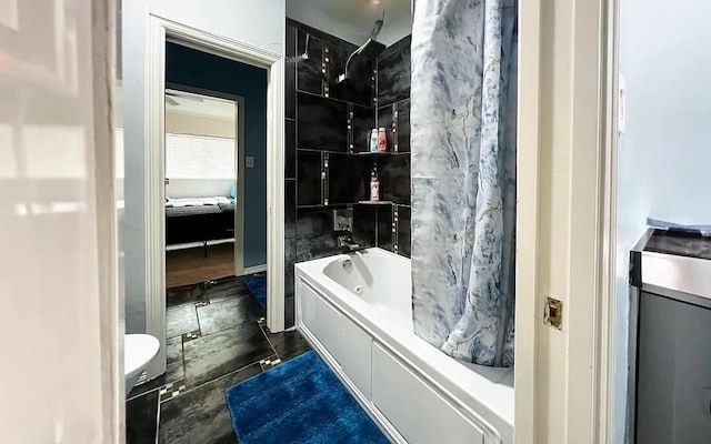 full bathroom with shower / tub combo and tile walls