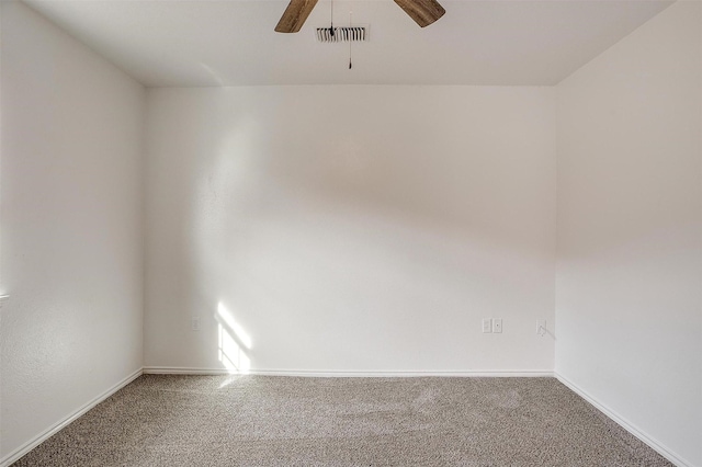 unfurnished room featuring baseboards, visible vents, ceiling fan, and carpet flooring