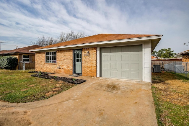 single story home featuring a garage, fence, driveway, and central AC unit