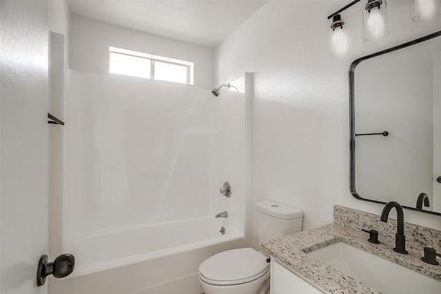 bathroom with toilet, vanity, and bathing tub / shower combination