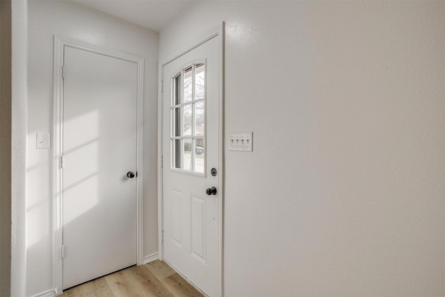 doorway featuring light wood finished floors