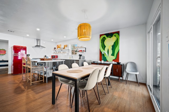 dining area with recessed lighting, visible vents, baseboards, and wood finished floors