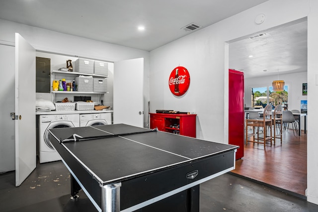 recreation room featuring finished concrete floors, washing machine and dryer, visible vents, and recessed lighting