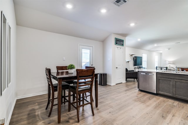 dining space with light wood-style flooring, visible vents, baseboards, and recessed lighting