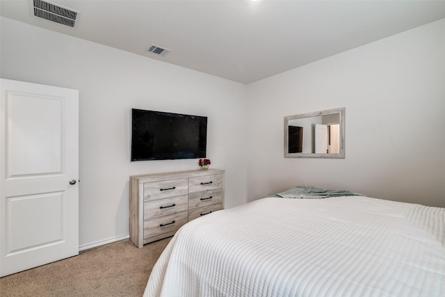 bedroom with light carpet and visible vents