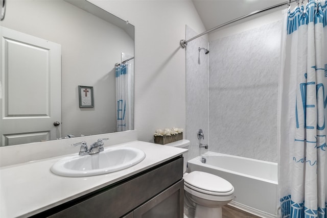 bathroom with toilet, shower / bath combo, and vanity