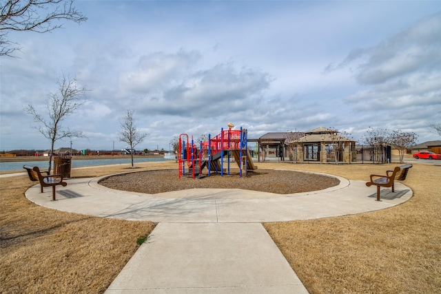 communal playground featuring a lawn