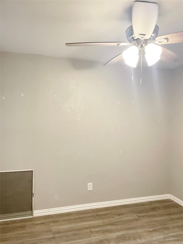 empty room featuring light wood-style floors and baseboards