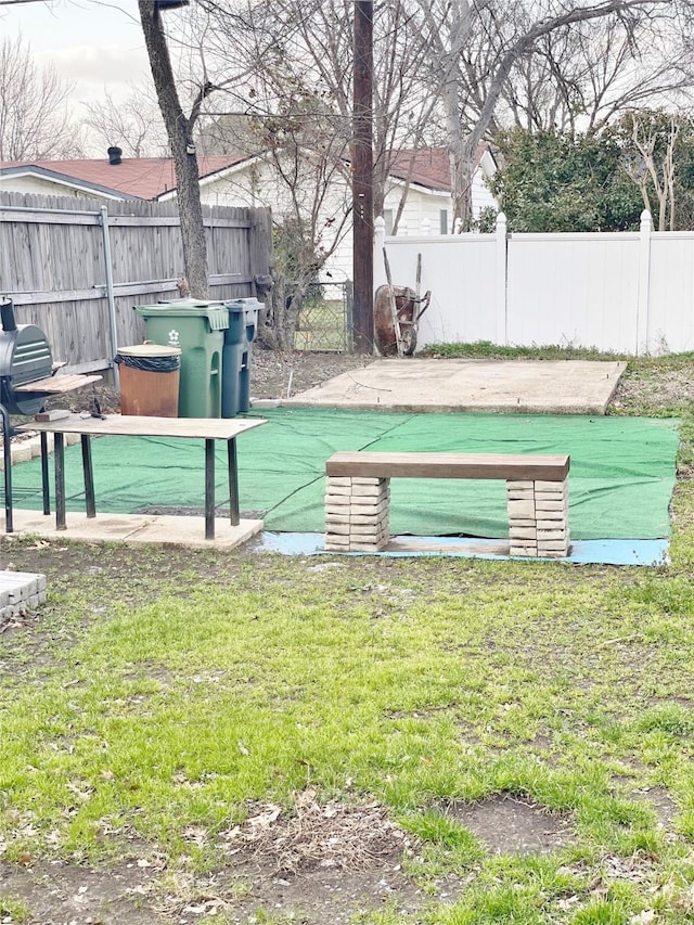 exterior space featuring a lawn and fence