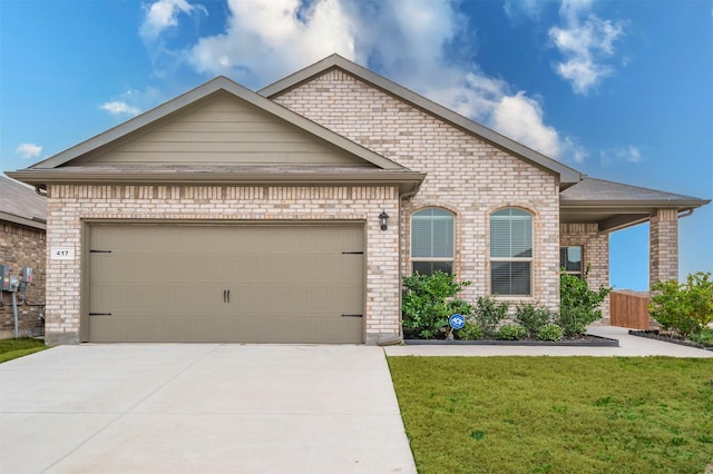 french country style house featuring driveway, a front lawn, an attached garage, and brick siding