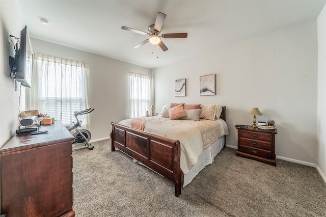 bedroom featuring ceiling fan, baseboards, and light colored carpet