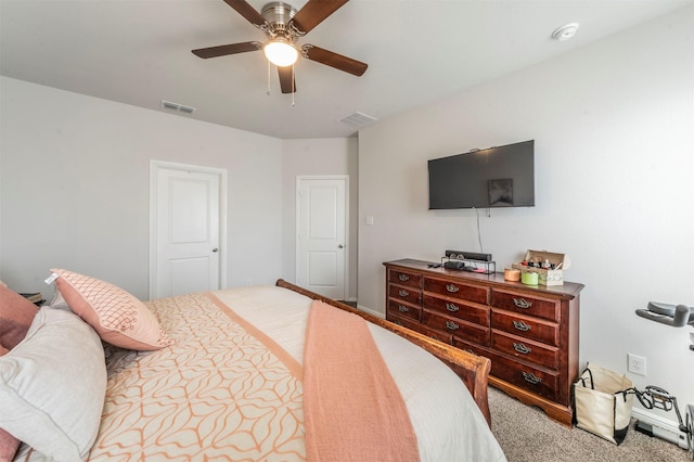 carpeted bedroom with visible vents and a ceiling fan