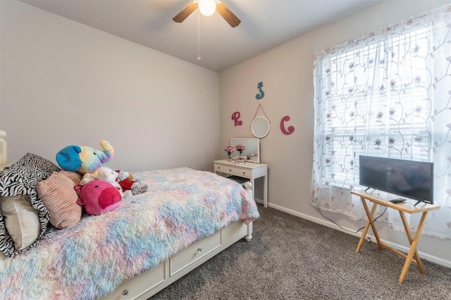 carpeted bedroom featuring ceiling fan and baseboards