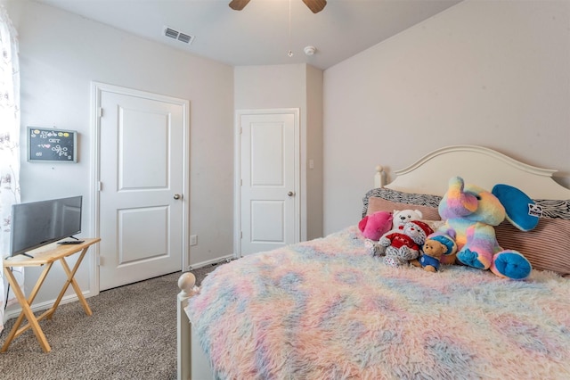 bedroom with a ceiling fan, baseboards, visible vents, and carpet flooring