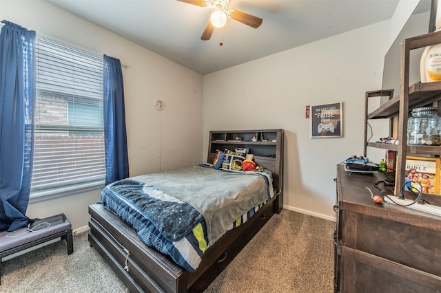 bedroom with ceiling fan, carpet, and baseboards