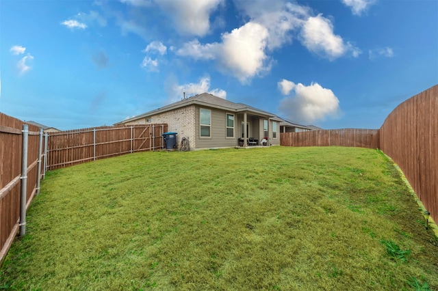 view of yard with a fenced backyard