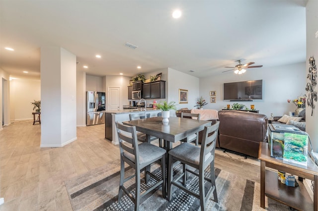 dining space featuring ceiling fan, recessed lighting, visible vents, baseboards, and light wood finished floors