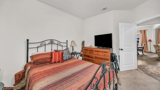 bedroom featuring visible vents and carpet flooring