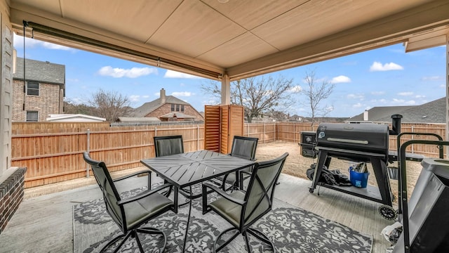 view of patio / terrace with a fenced backyard and outdoor dining area